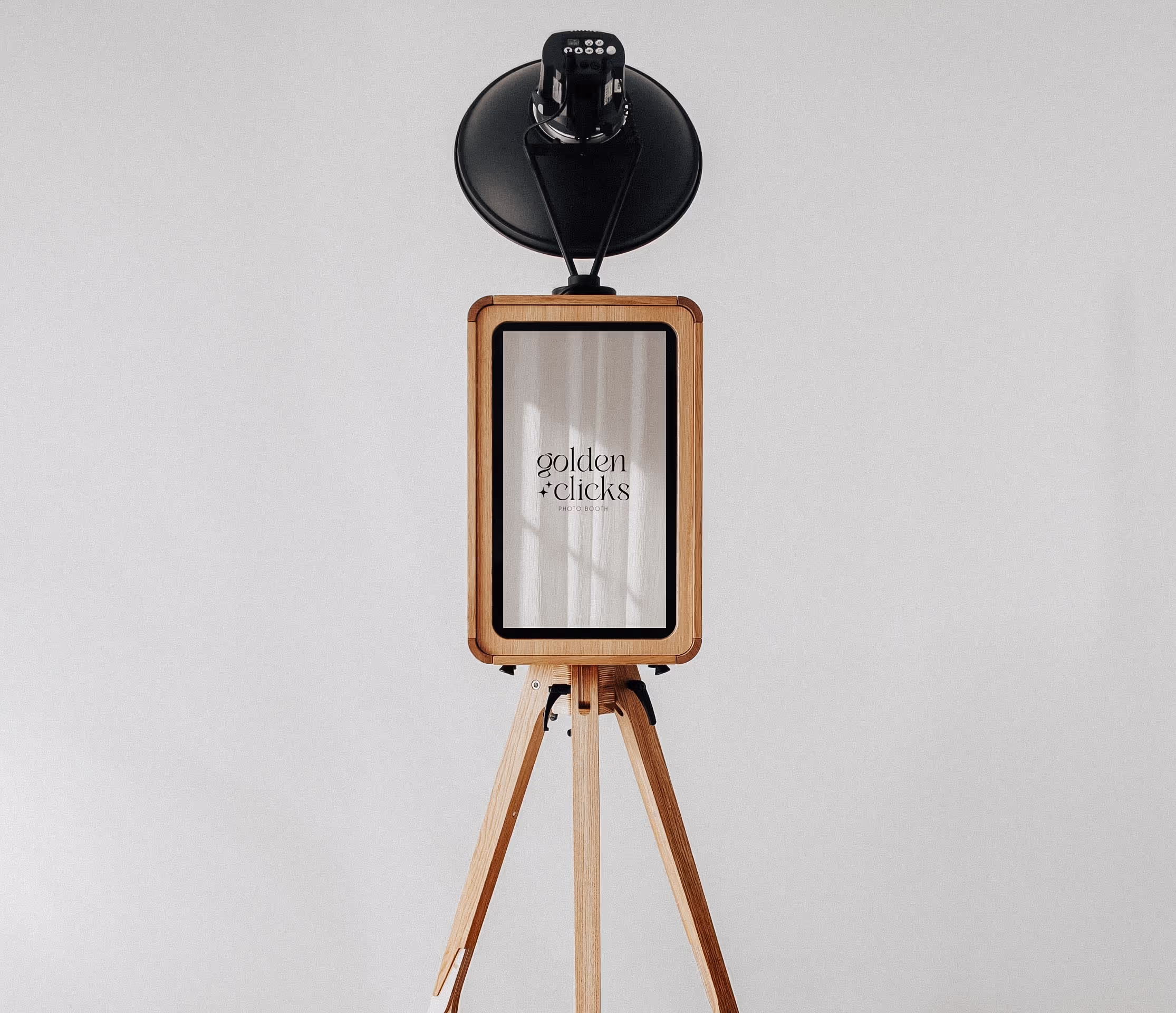 Experience a luxury photo booth like no other in Central Florida. Perfect for weddings, corporate events, and upscale parties. Capture memories with Golden Clicks' sleek, high-tech photobooth setup.