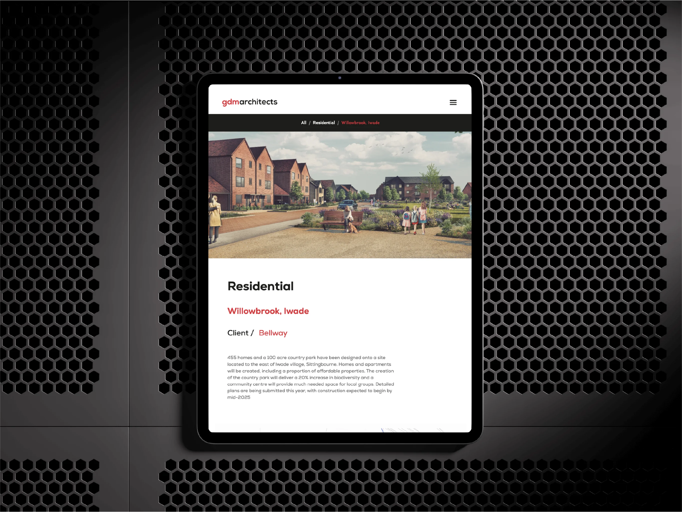 Digital tablet displaying a residential project webpage for Willowbrook, Iwade by gdm architects, featuring a photo of houses and people in a park.