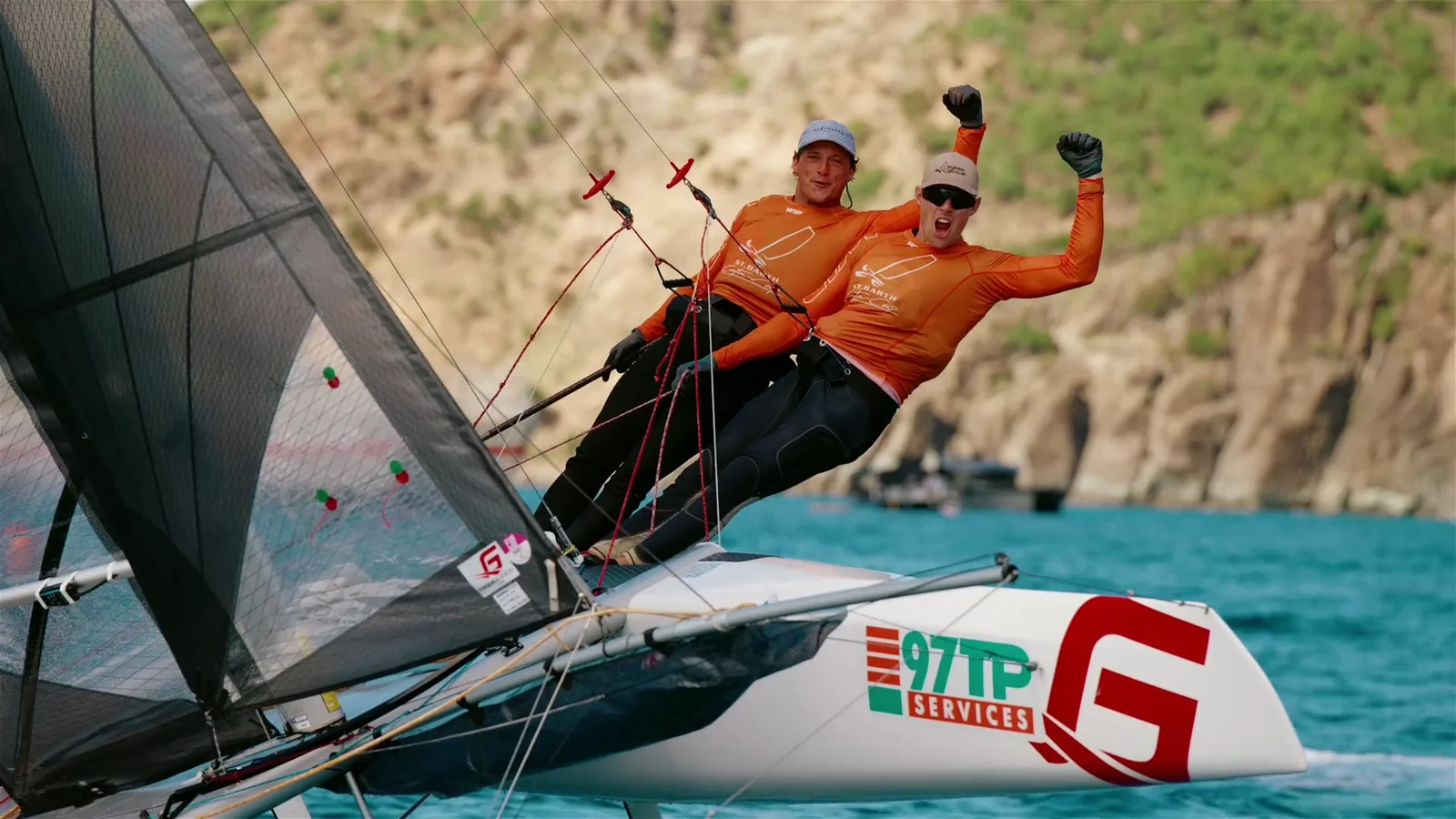 Crew sailing a racing catamaran