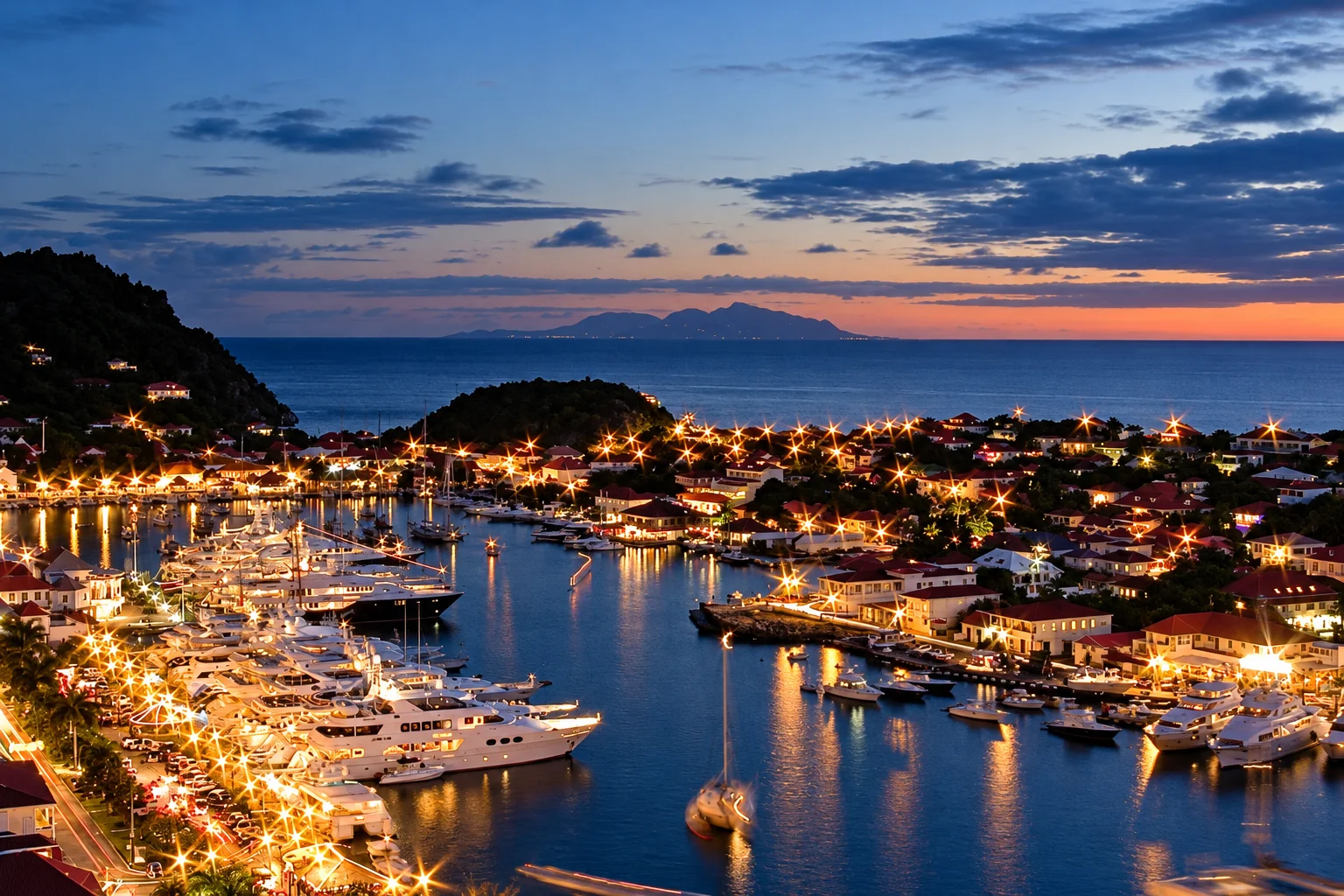 Gustavia harbour illuminated at dusk