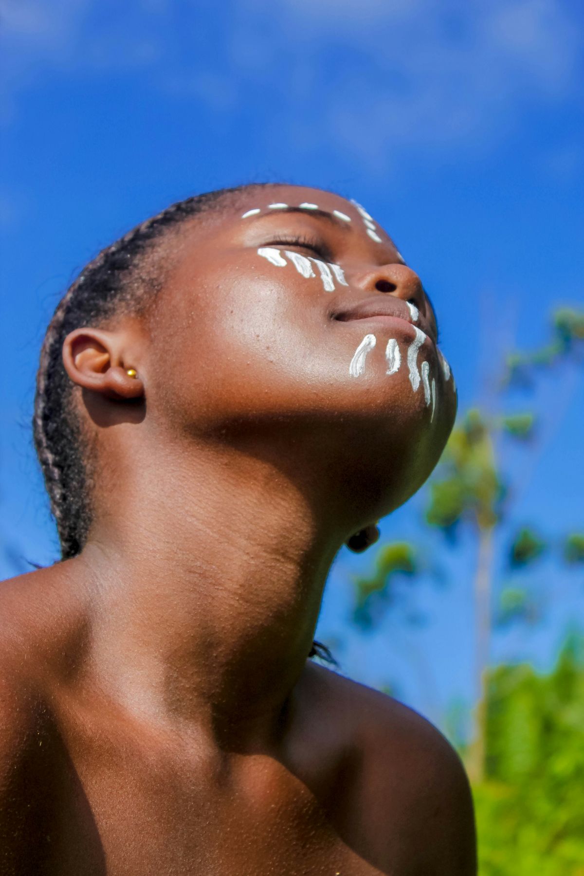 Close up of a relaxed woman receiving a facial hydration treatment in a spa setting