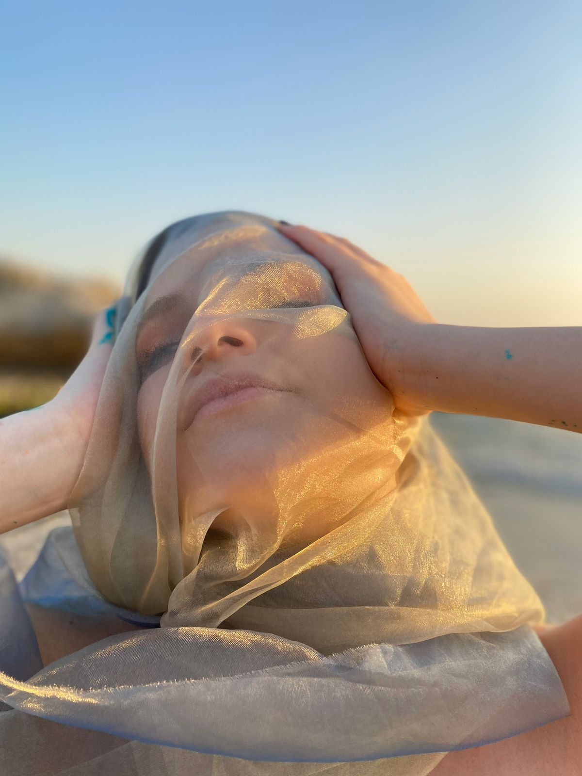 Close up of a relaxing facial treatment with steam and soft hands applying product, spa atmosphere.