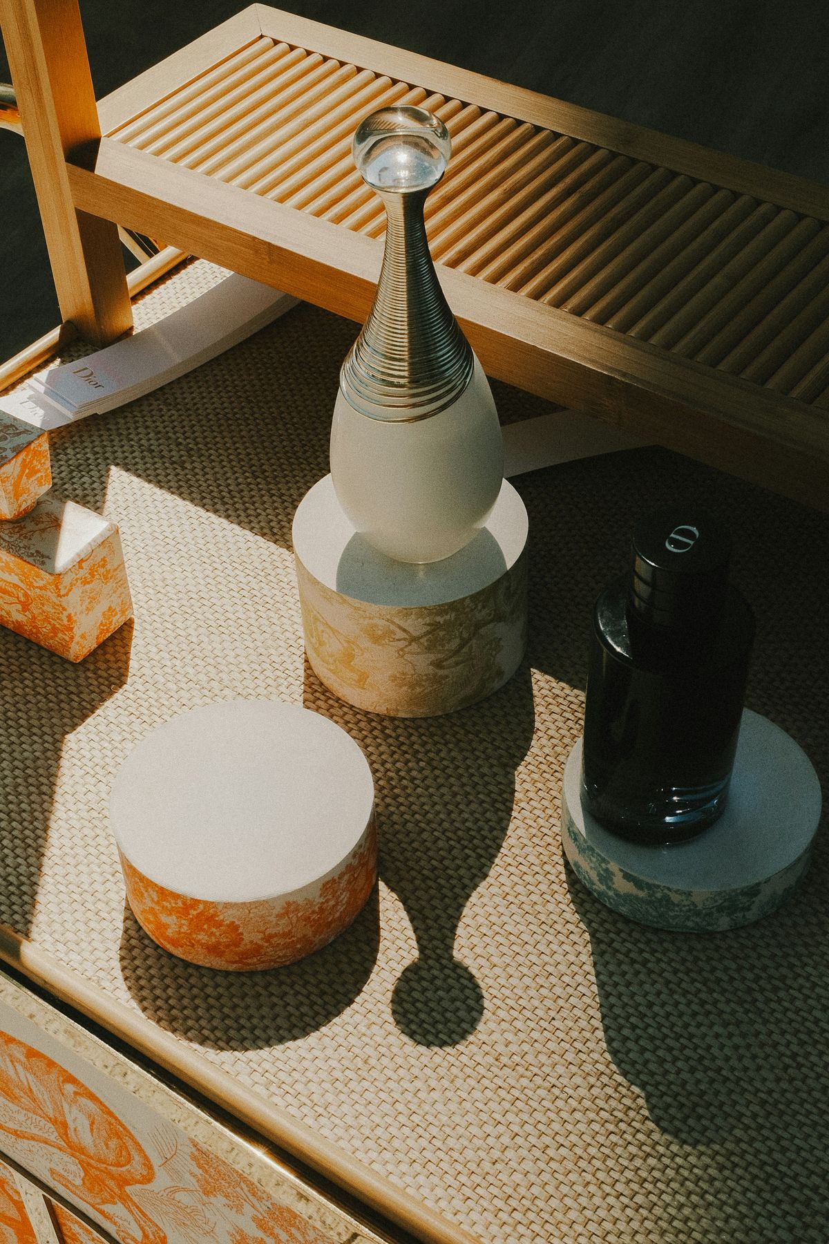 Close up of diverse skincare products bottles and jars on a marble table