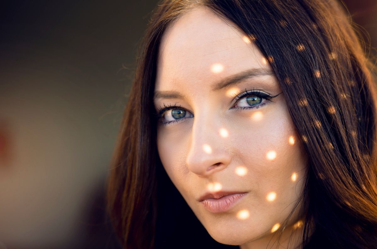 Photo editing software interface showing color correction on a beauty portrait