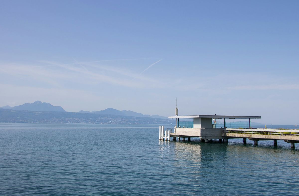 Peaceful view of Lake Geneva near Lausanne, representing the calm vibe of the city