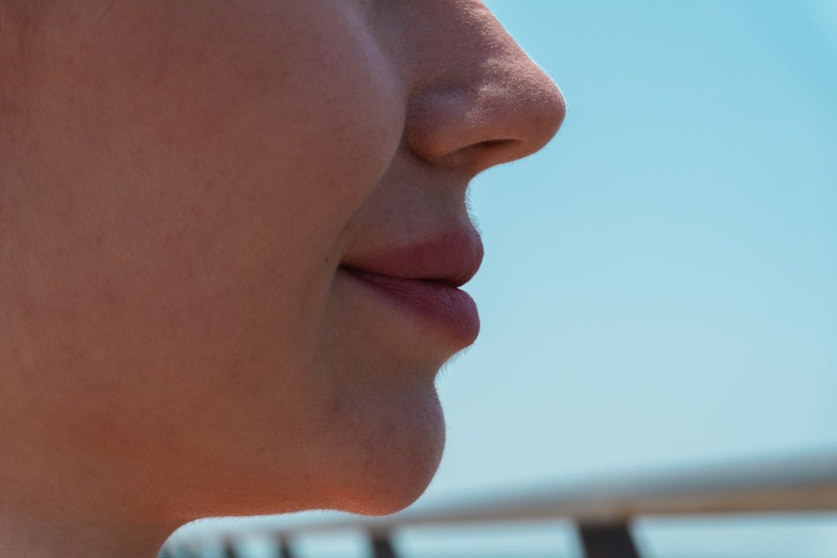 Close-up profile of a woman's mouth and chin