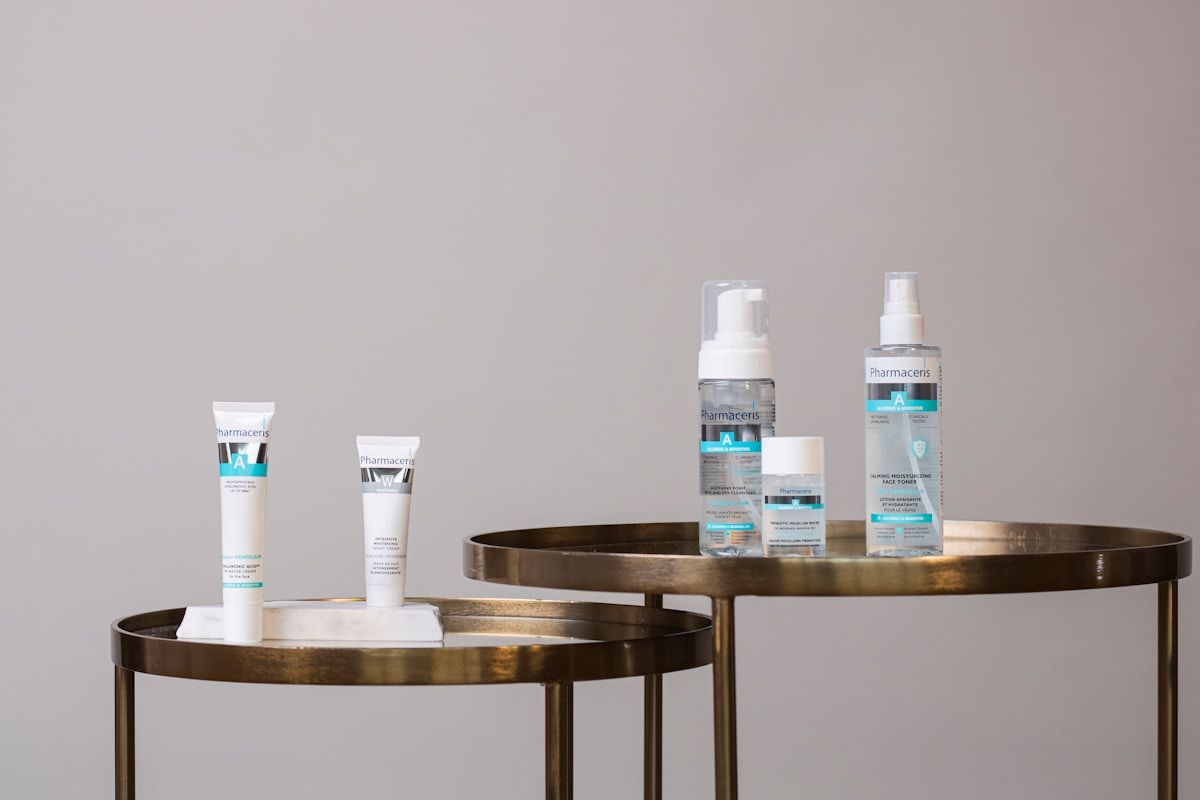 white and blue plastic bottles on table