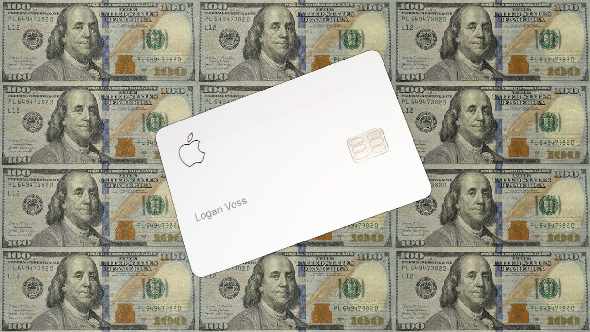 Apple card on a background of hundred dollar bills
