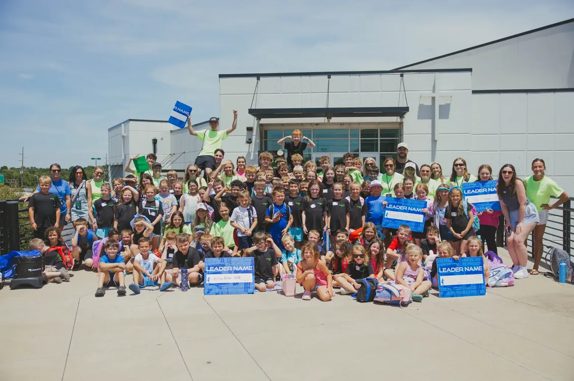 Summer Fest kids and leaders in a group photo outside the church