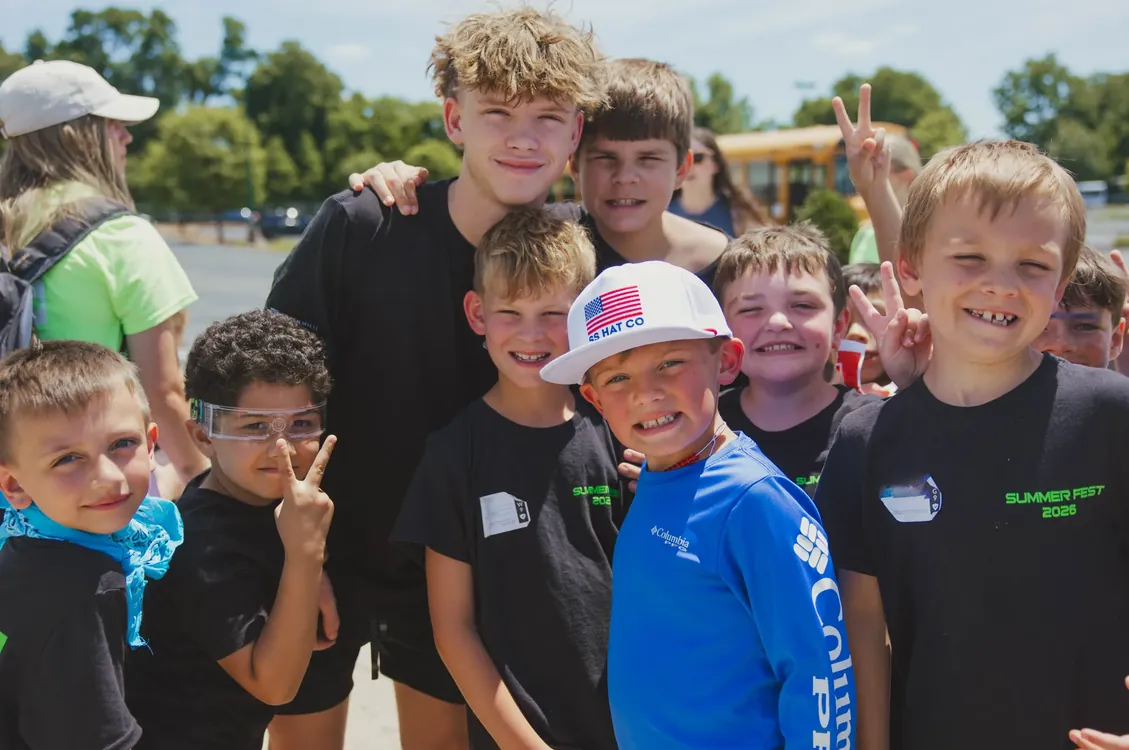 Group of smiling boys outside at Summer Fest