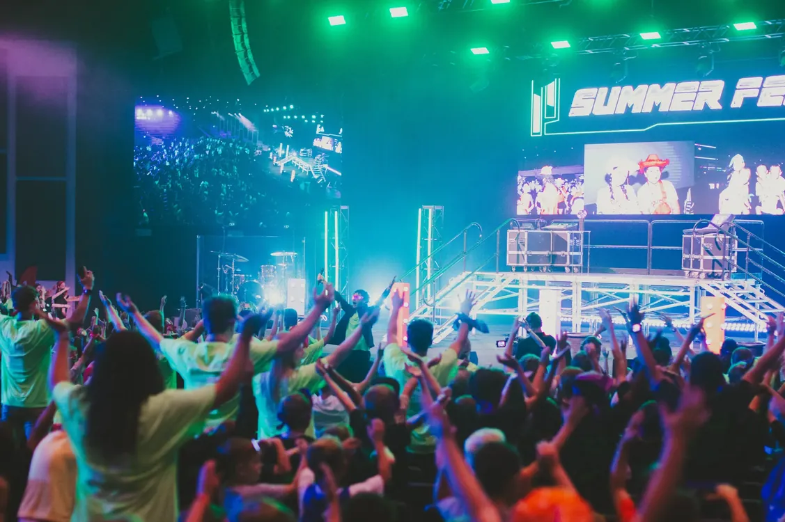 Kids worshiping in front of the Summer Fest main stage