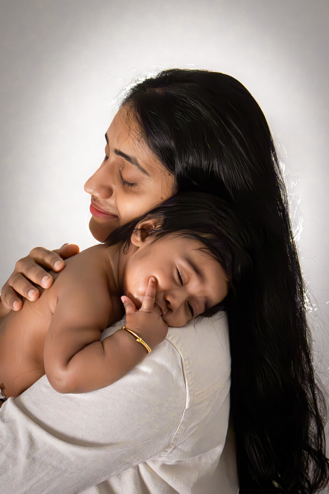Baby on mother's shoulder