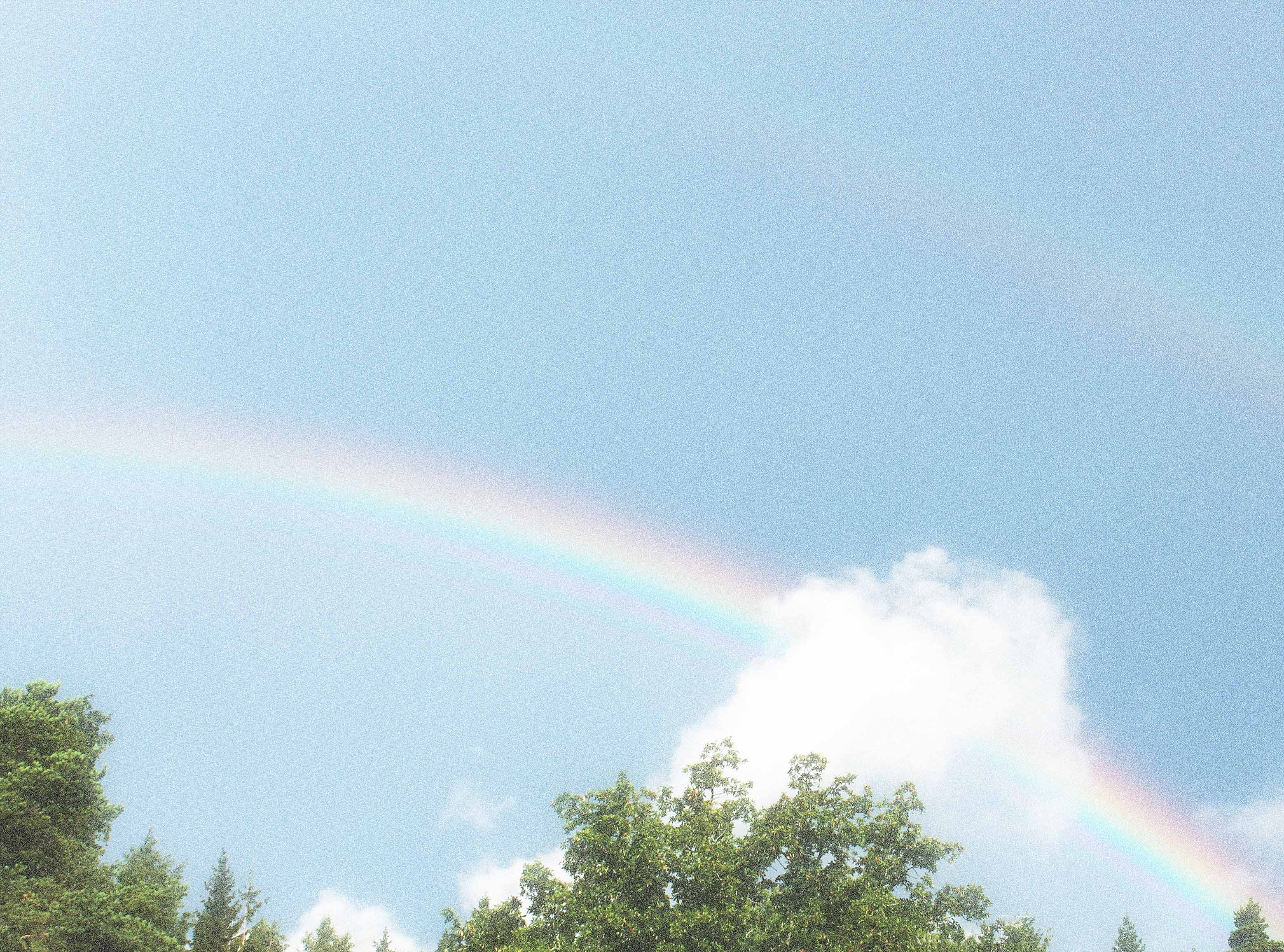 blue sky with rainbow