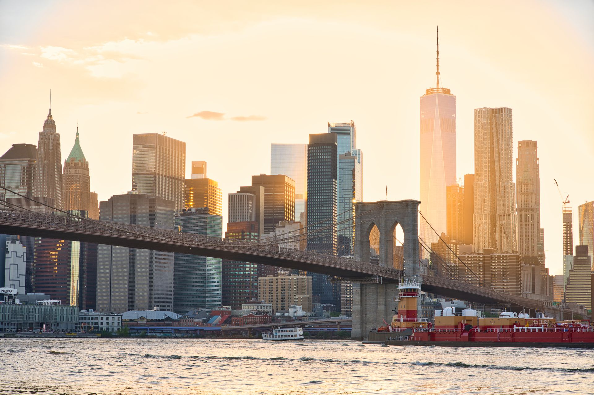Brooklyn Bridge and Lower Manhattan skyline at sunset