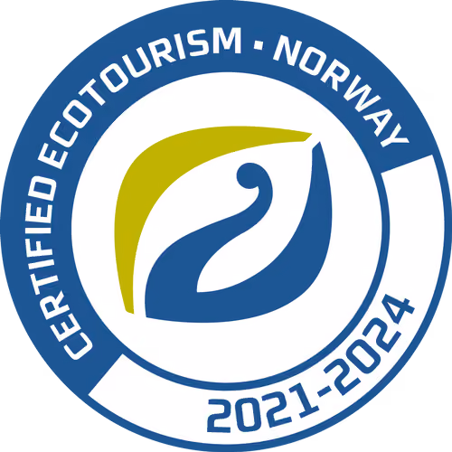 Seal with text Certified Ecotourism Norway 2021-2024 and blue and green leaf emblem in circle.