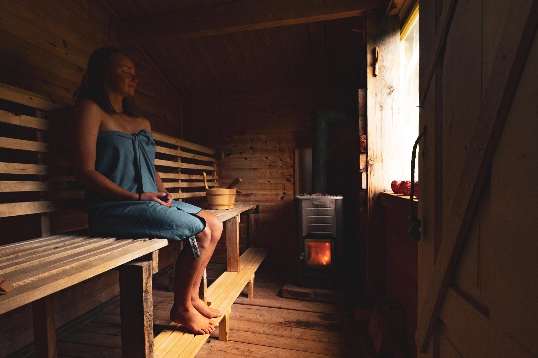 woman sitting in a sauna
