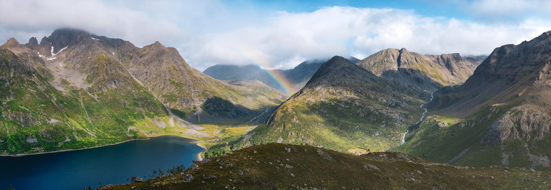 beautiful landscape with a rainbow in the distance