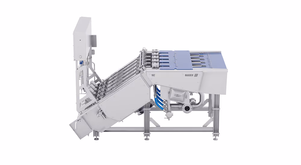Side view of an industrial stainless steel machine with pipes and mechanical parts on a white background.