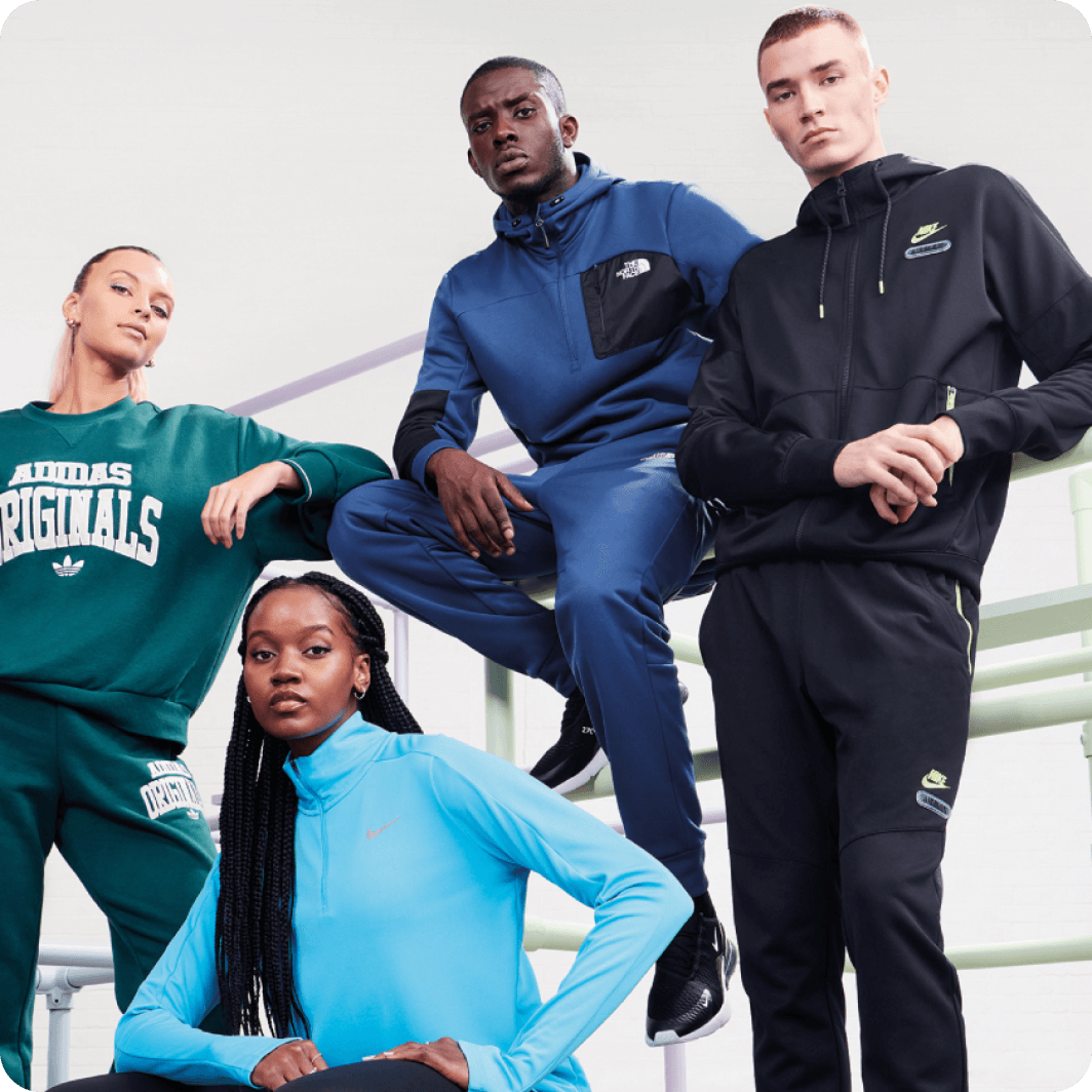 a group of people dressed in sports equipment posing for a picture