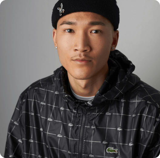 a man wearing a black hat and jacket