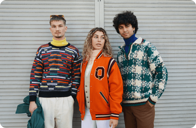 a group of three people standing next to each other