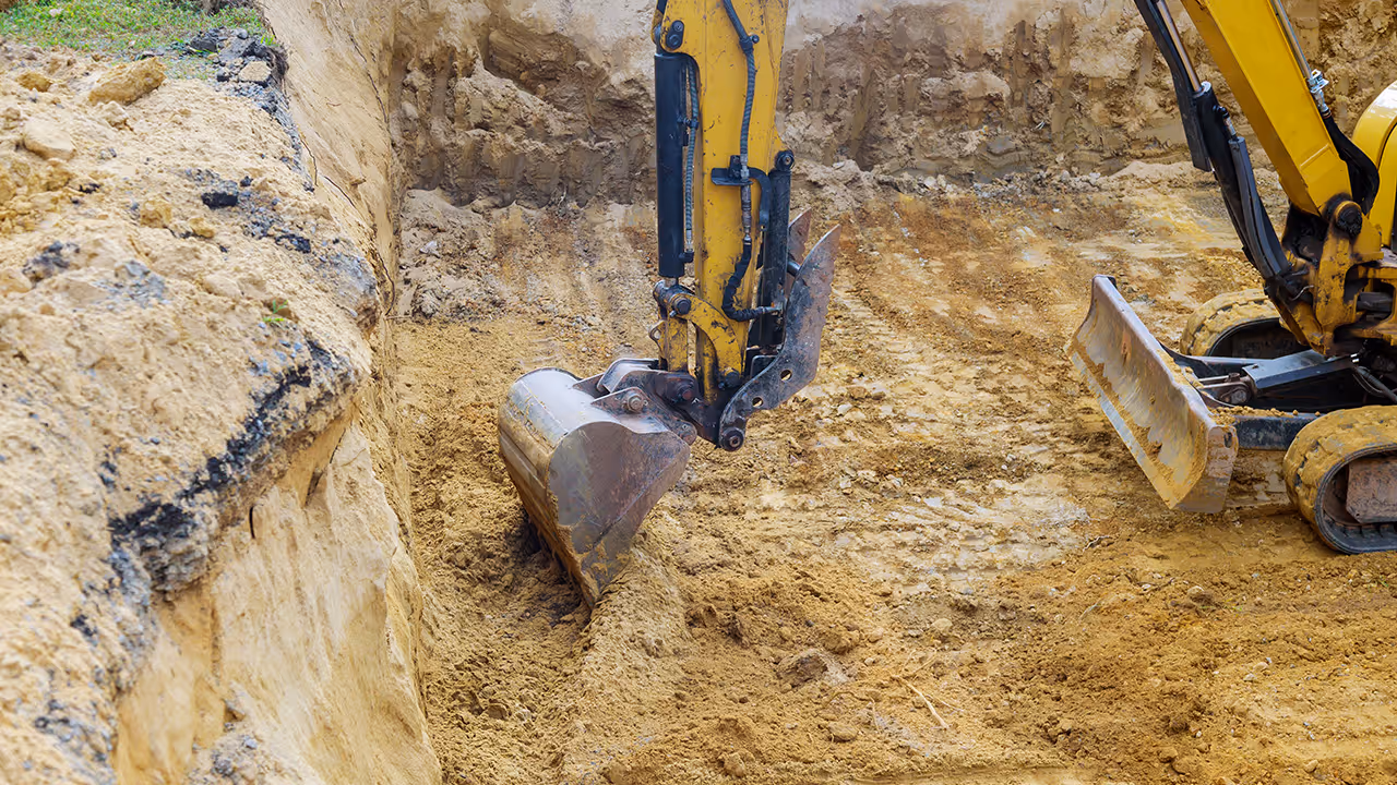 Excavation machines digging a foundation.