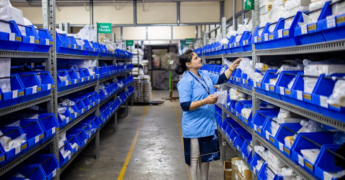 Worker organizing inventory in warehouse where 3PL fulfillment chargebacks start at the pick face