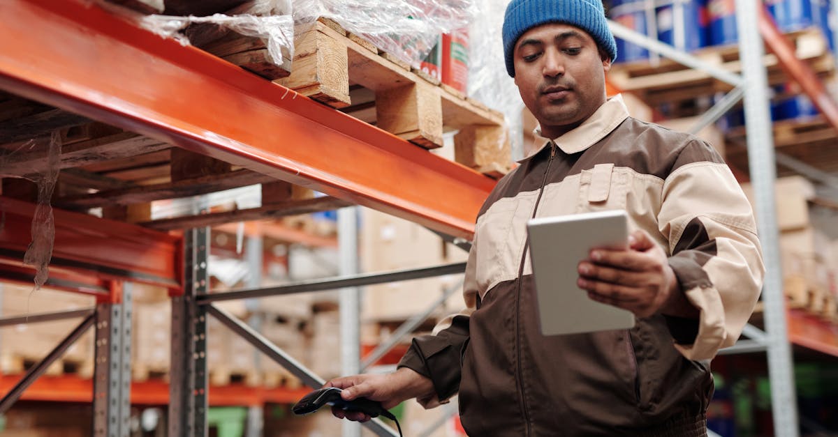 Warehouse employee scanning inventory items with tablet for 3PL fulfillment chargeback reduction