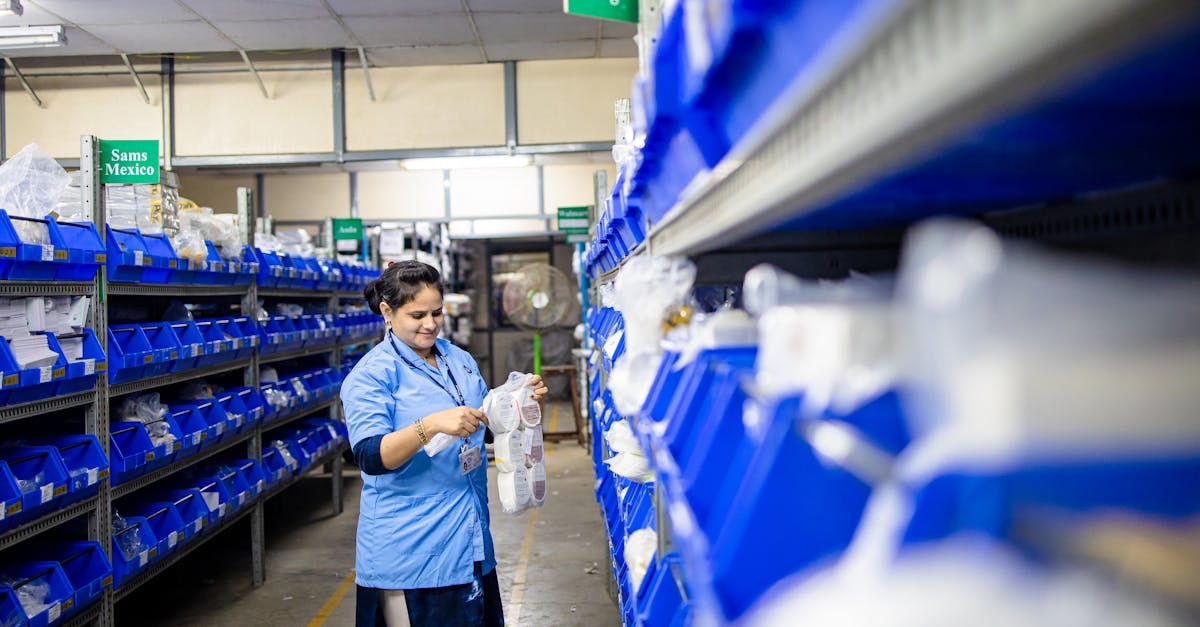 Female worker organizing shelves in warehouse for 3PL inventory accuracy program in 2026