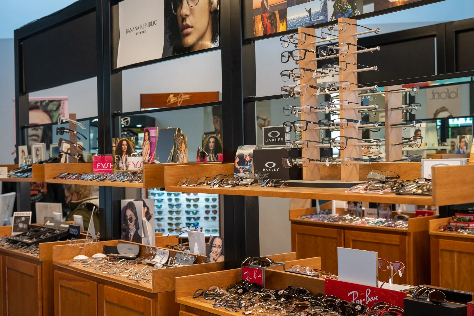 Ray-Ban, Oakley, Banana Republic glasses displayed 