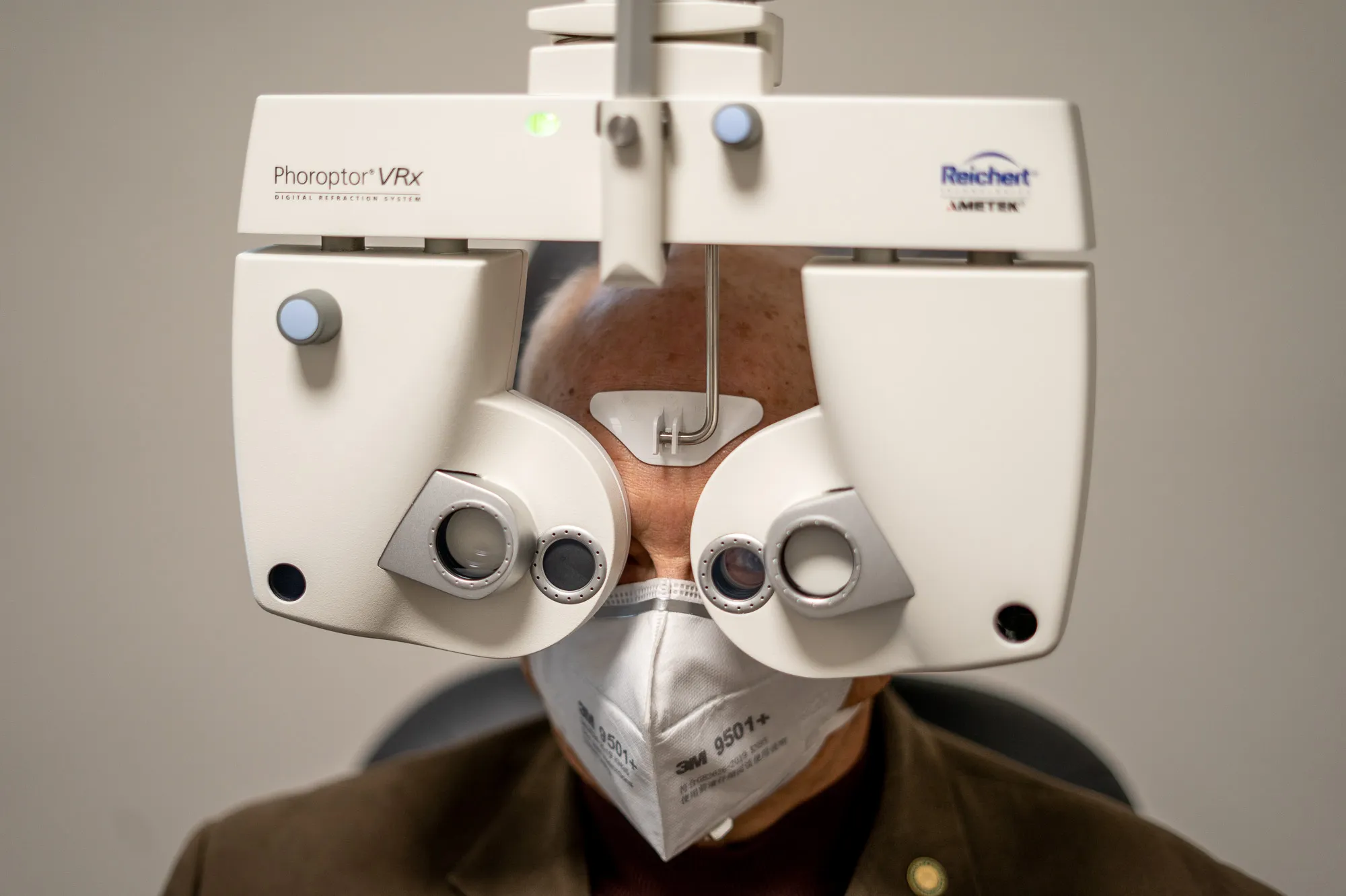 Man getting his eyes checked with a Phoroptor VRx