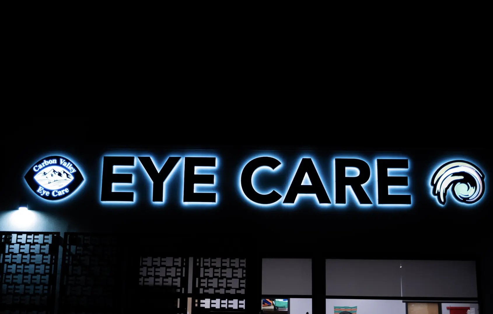 Carbon Valley Eye Care sign lit up at night