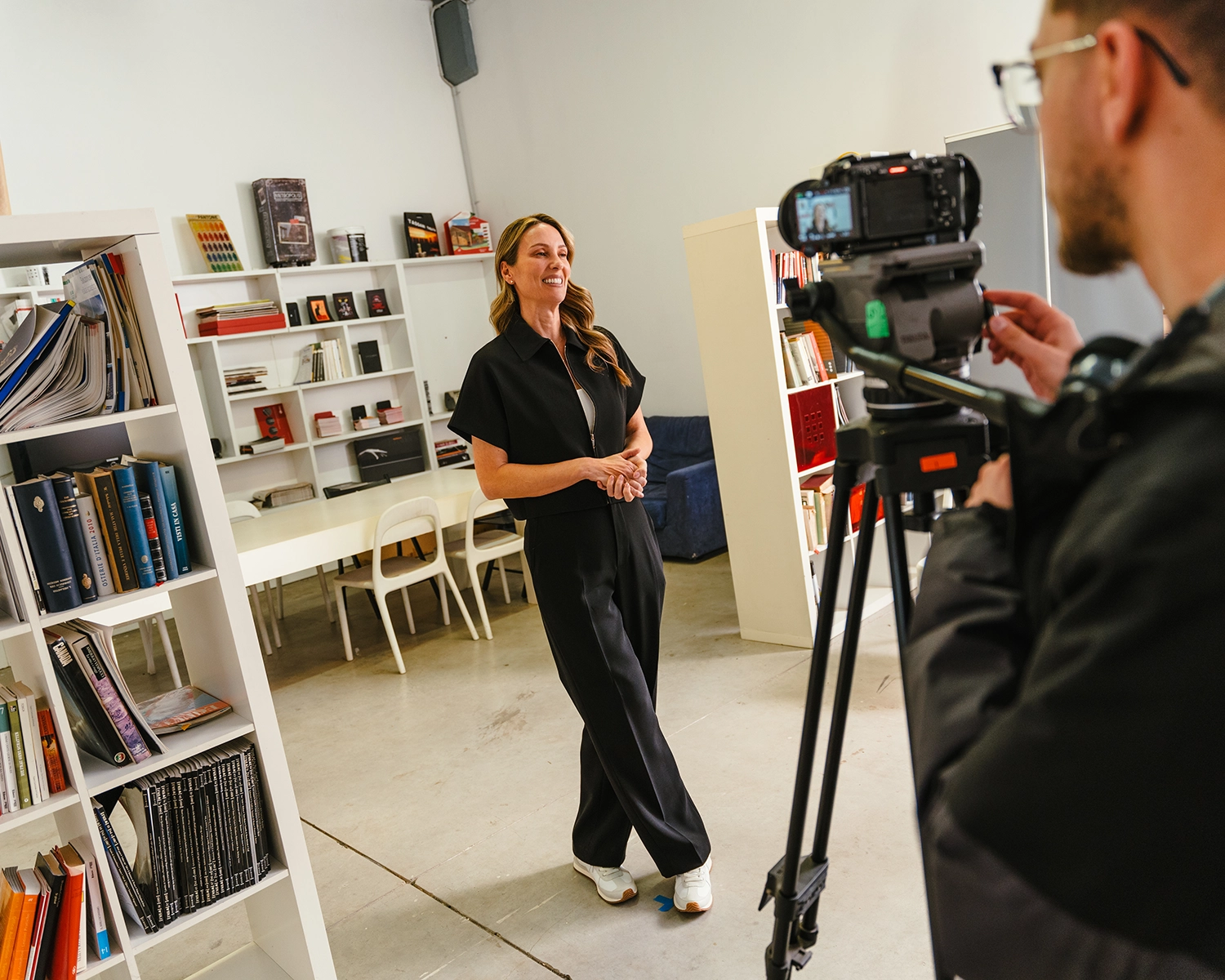 behind the scenes photo of a woman being interviewed on camera