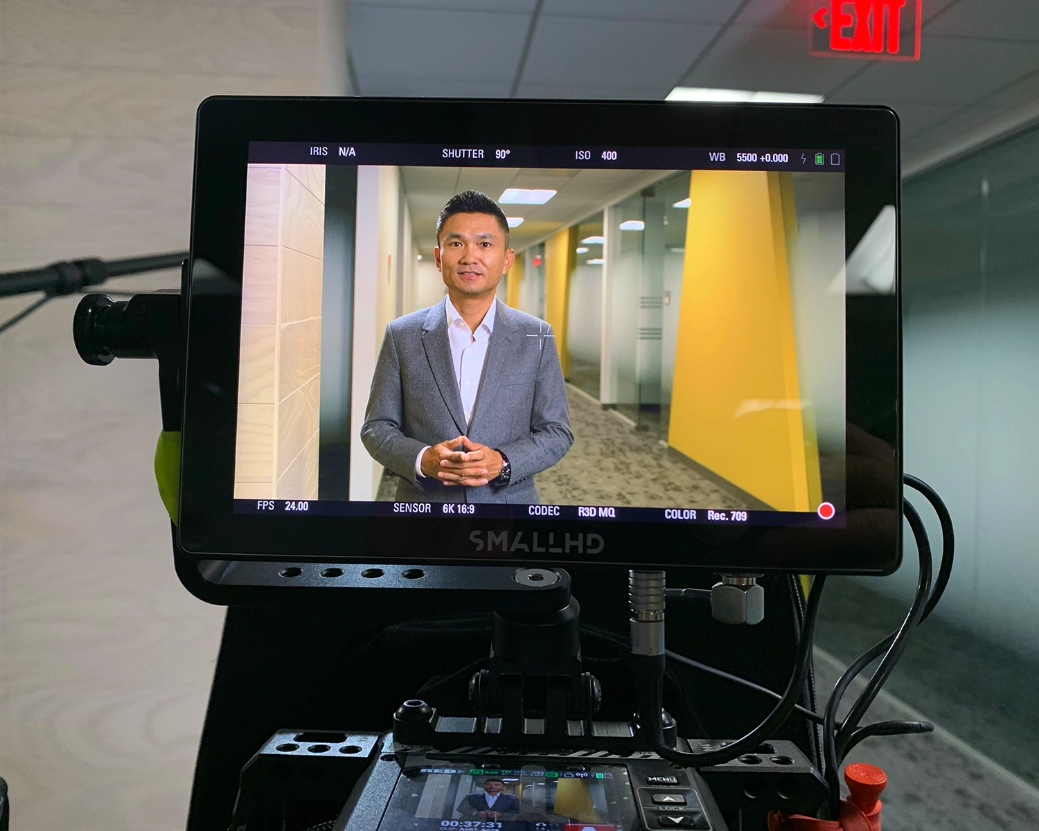 behind the scenes photo of man being interviewed