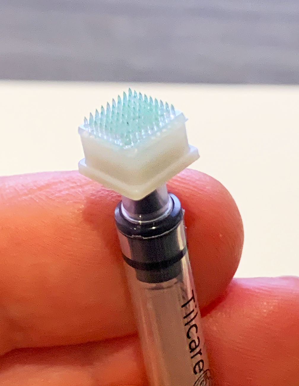 Fabricated-Hybrid-Microneedle-Arrays attached to a syringe with an adaptor