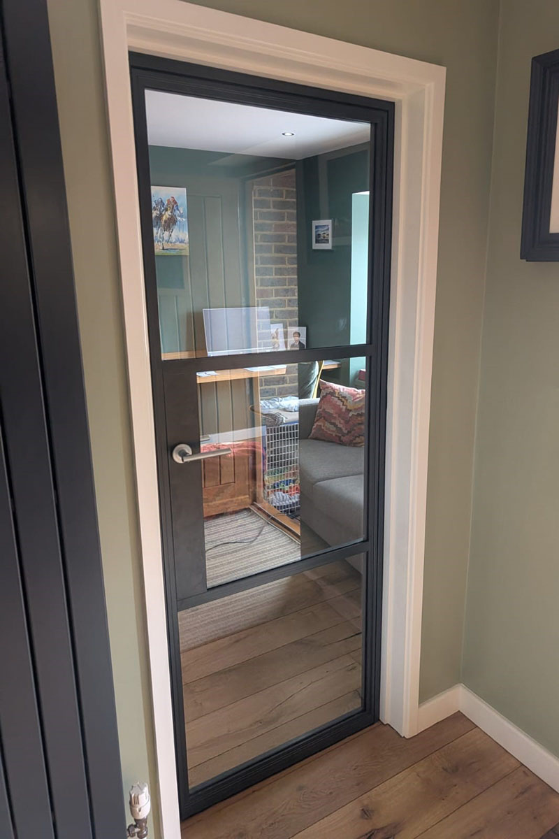 Glass door with aluminium critall style surround in interior