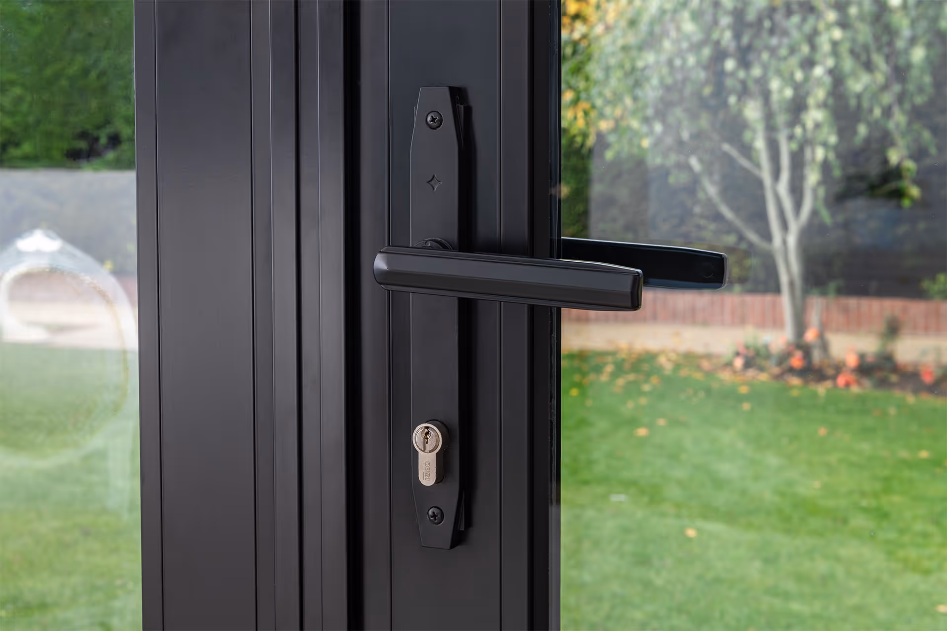Stylish Black Art Deco Handle on Heritage glazed door looking out into garden