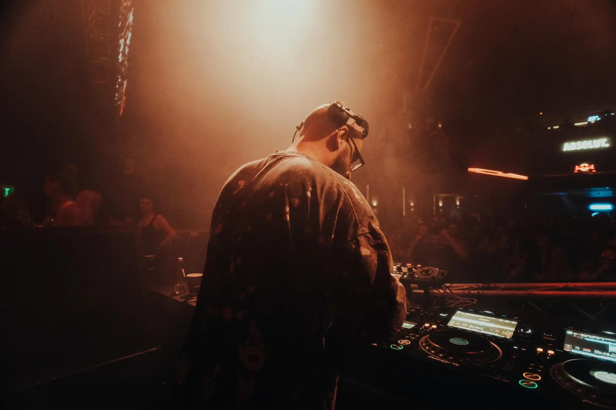 techno-dj-performing-on-stage