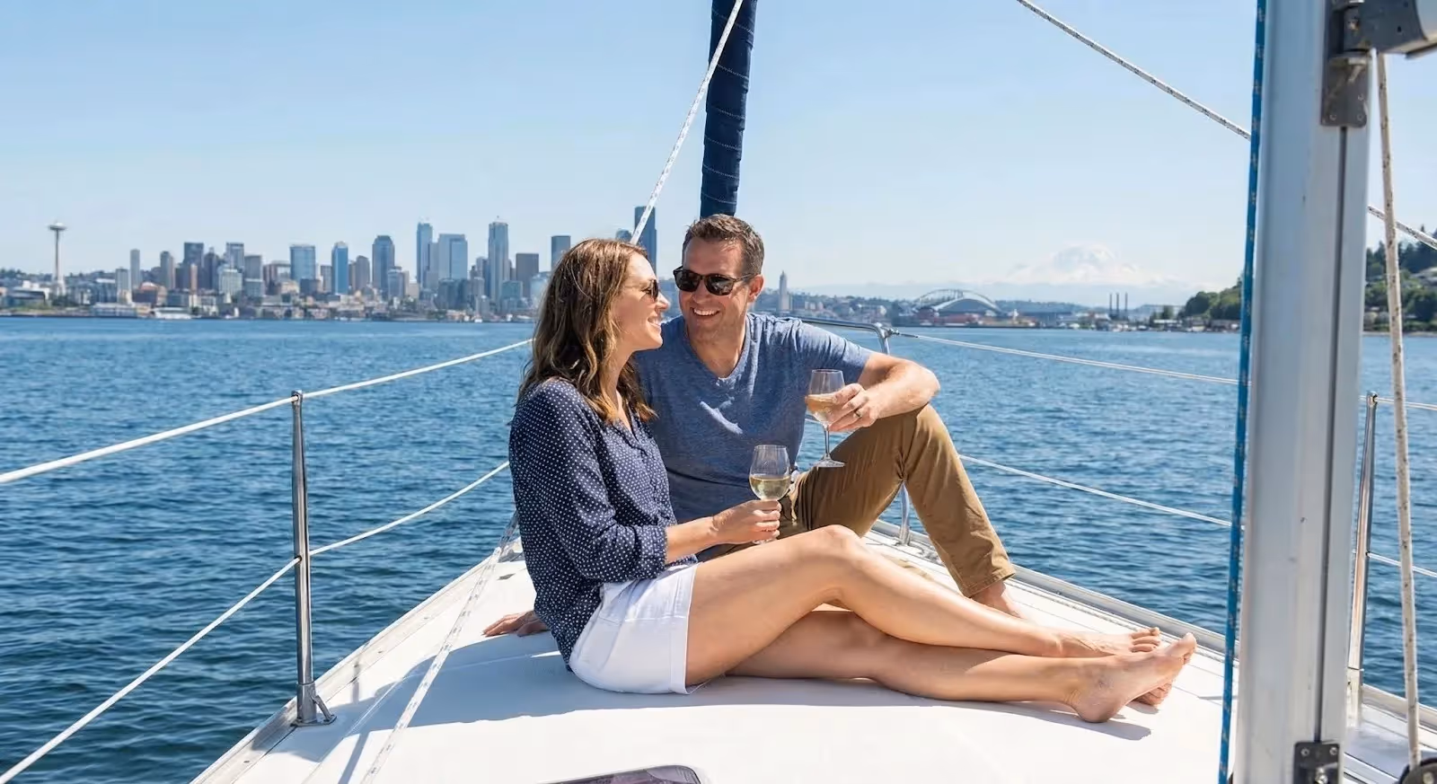 Seattle rental property owners relaxing on a boat, symbolizing time freedom gained by hiring professional property management.
