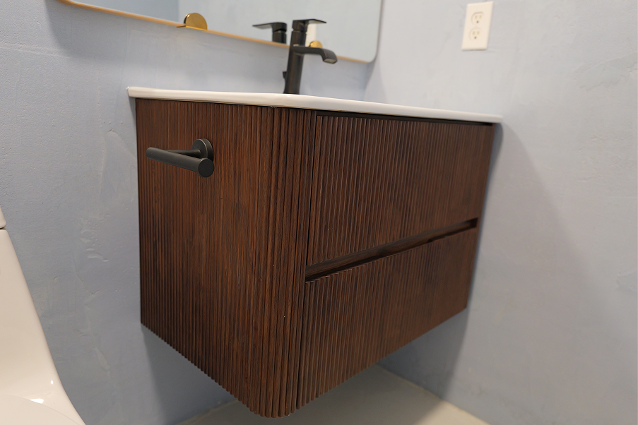 Ribbed walnut floating bathroom vanity with two drawers and matte black hardware installed by DuetRight in Kirkland