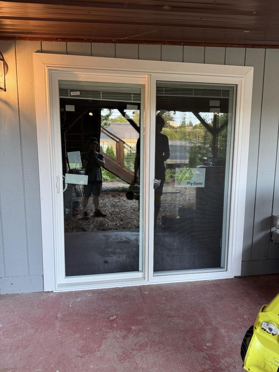 The replacement right-hand sliding patio door installed, viewed from the patio
