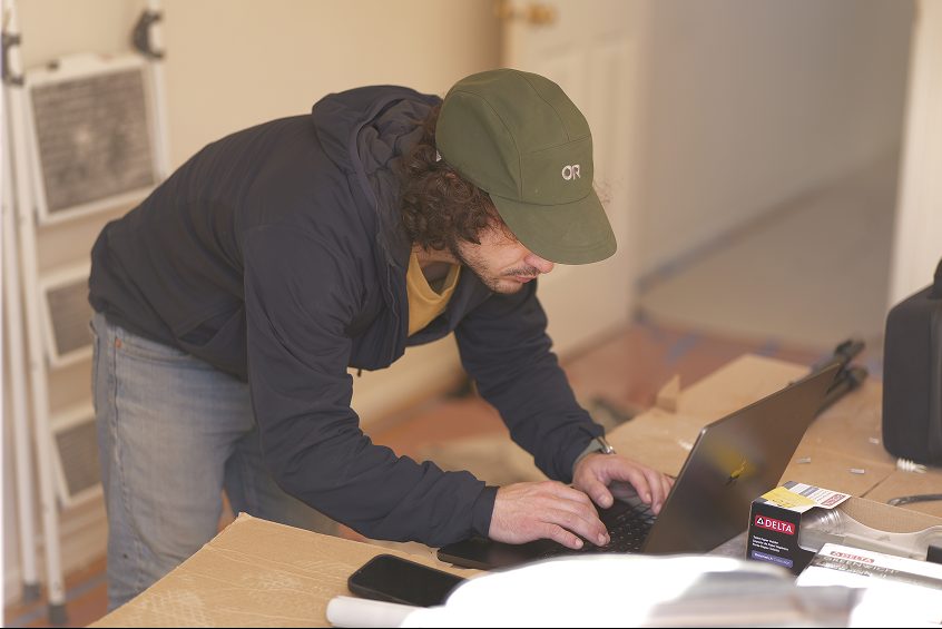 Angelo of DuetRight reviewing a renovation plan at a Seattle project