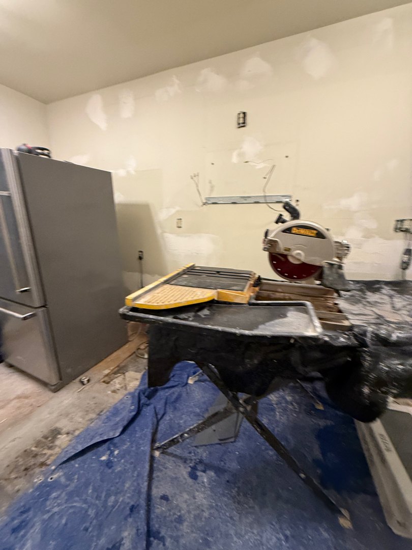 Capitol Hill condo kitchen stripped back to bare walls during demolition