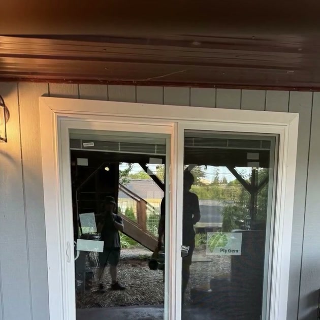Completed white sliding patio door after DuetRight installation in West Seattle.