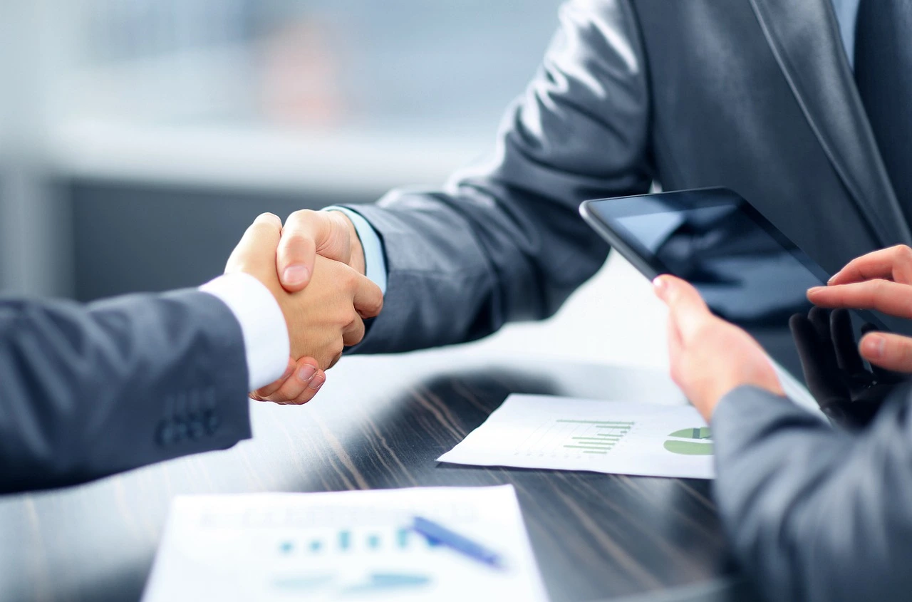 Business owner comparing capital funding and business loan options on a laptop
