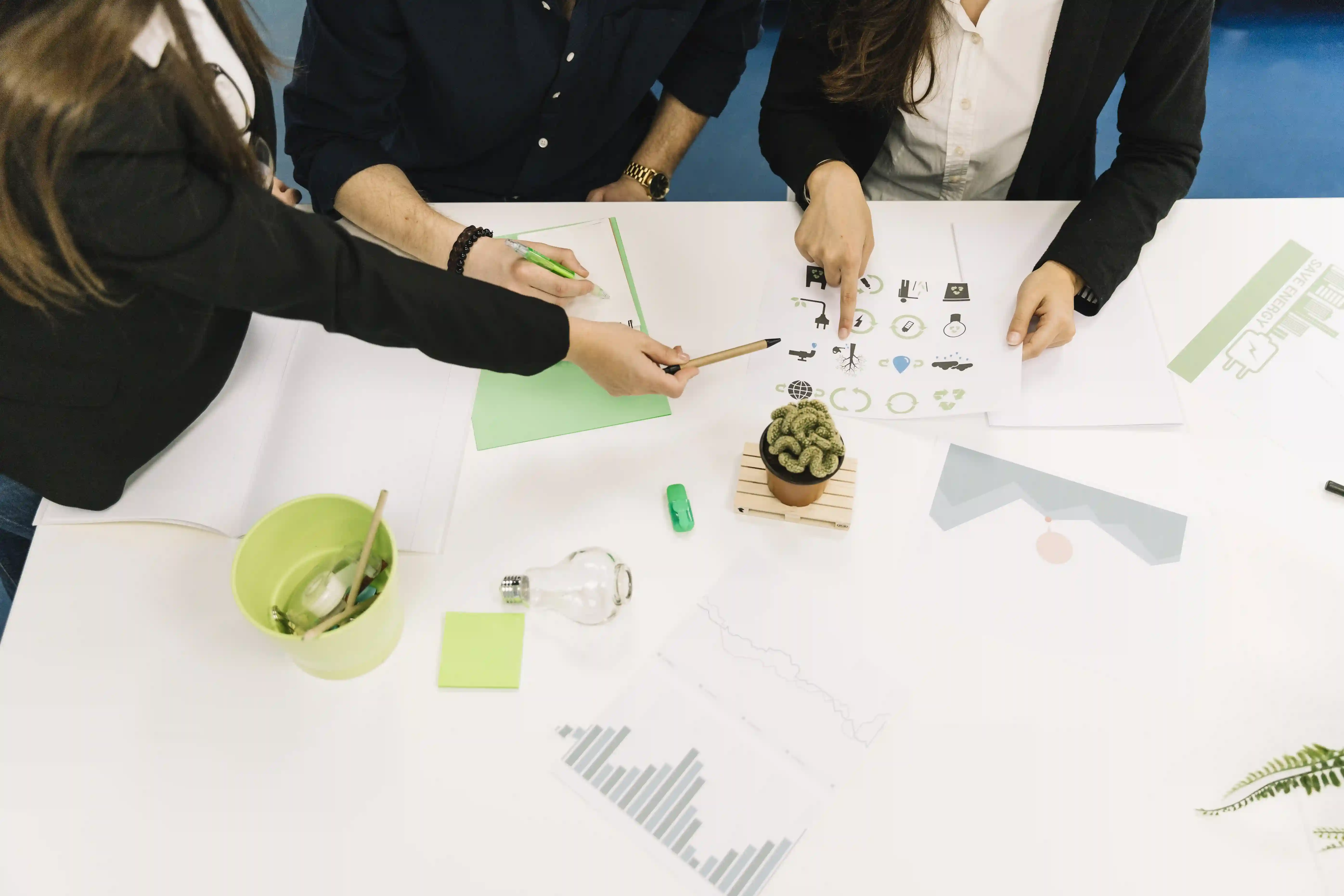 Entrepreneur planning how to raise capital for business growth using financial documents and strategy charts
