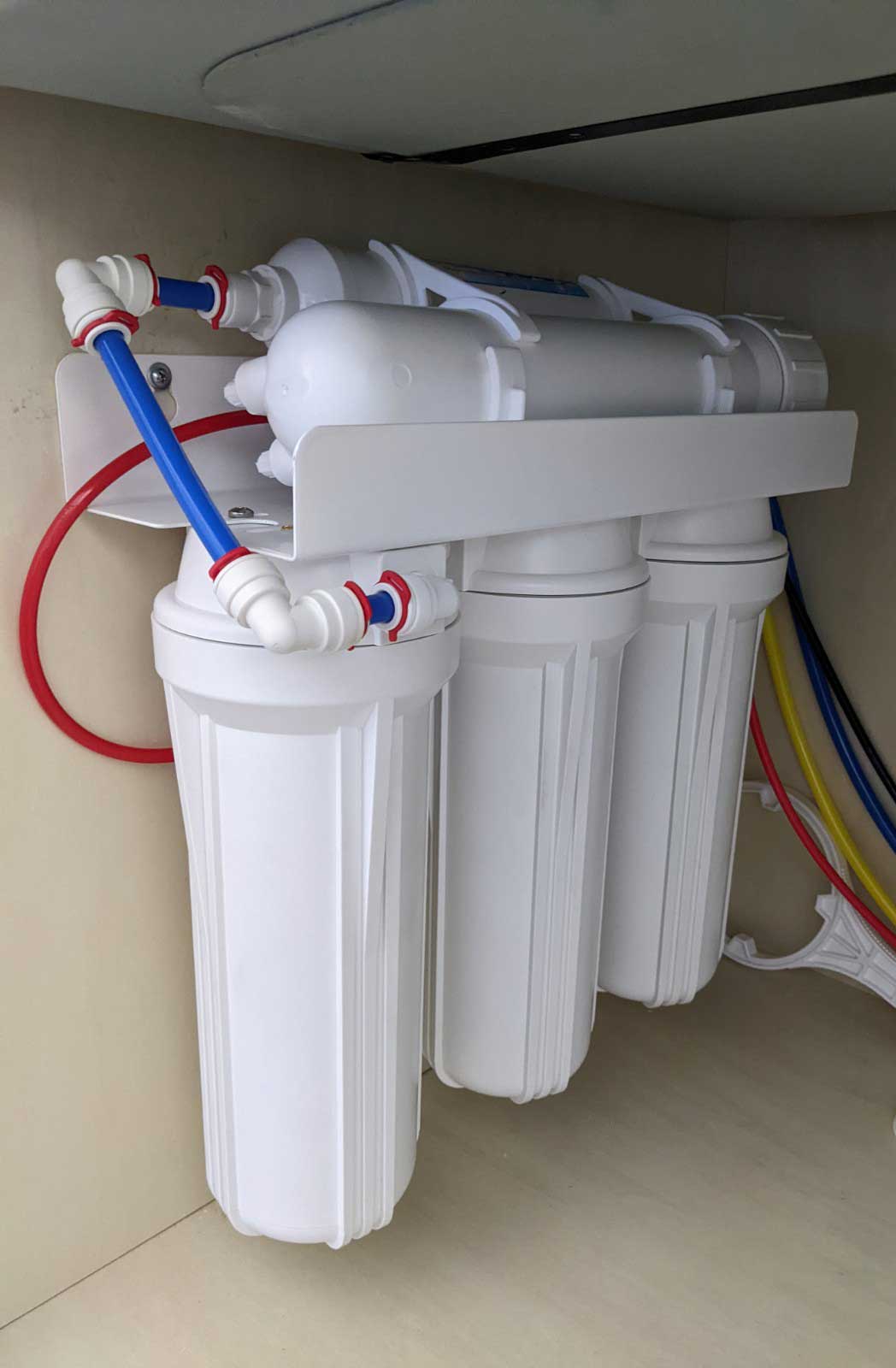Photo of a reverse osmosis (RO) system installed under a sink.