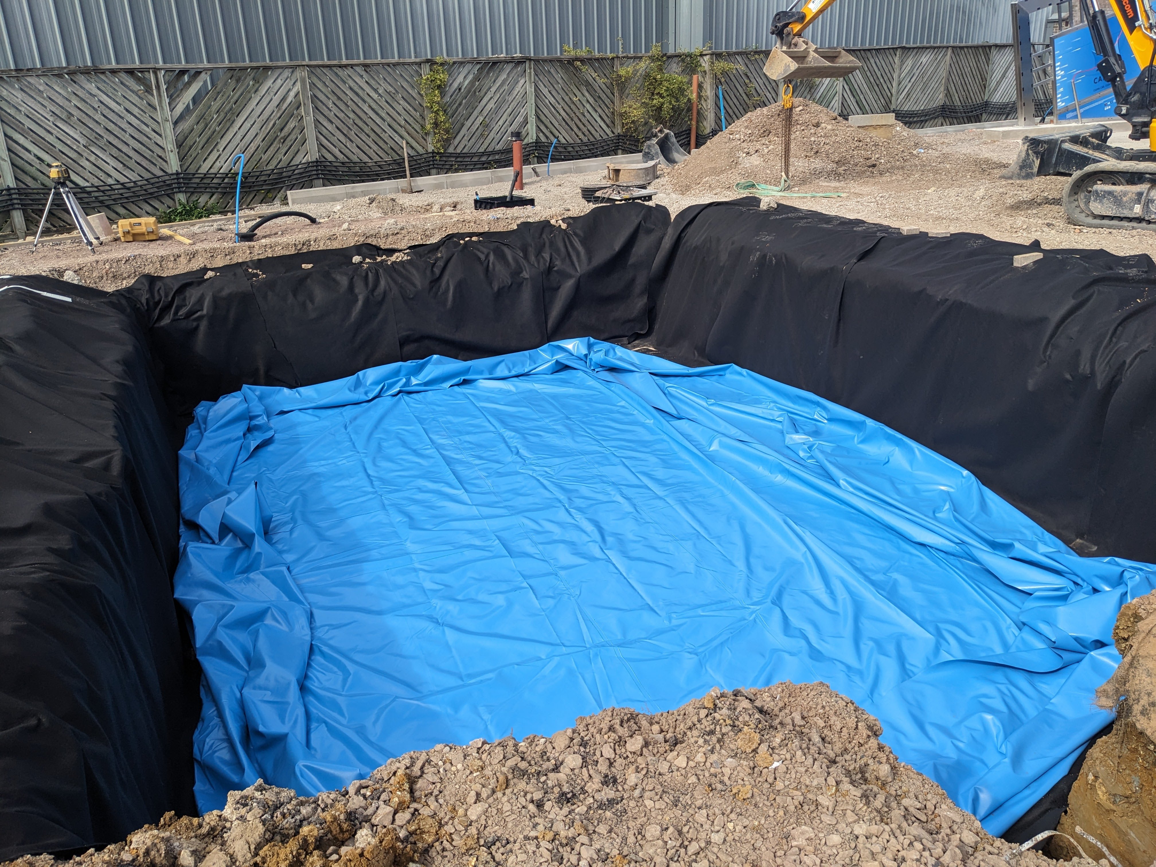 Geotextile and impermeable liner laid for an attenuation tank