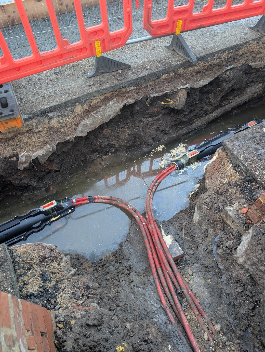 Open excavation in the footway with cable joints exposed