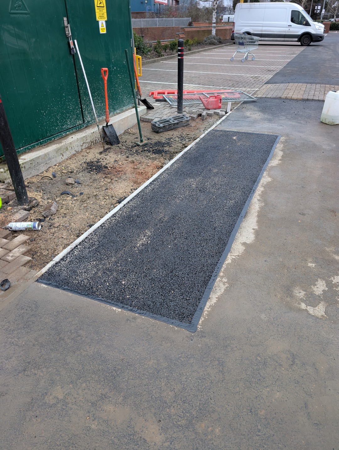 Completed footway reinstatement alongside a utility cabinet